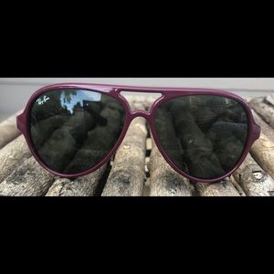 Woman’s raspberry color Ray-Ban Aviators.